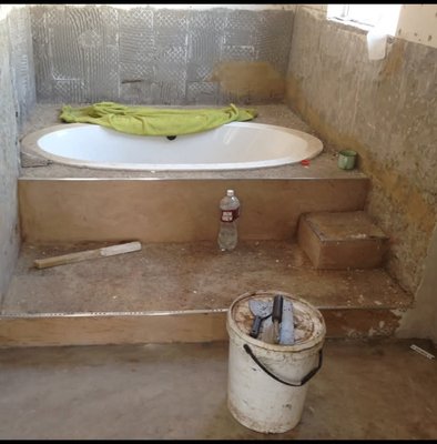 Bathroom floor before Quartz Carpet installation